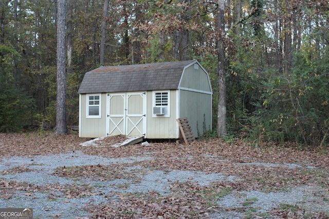 view of outbuilding featuring cooling unit