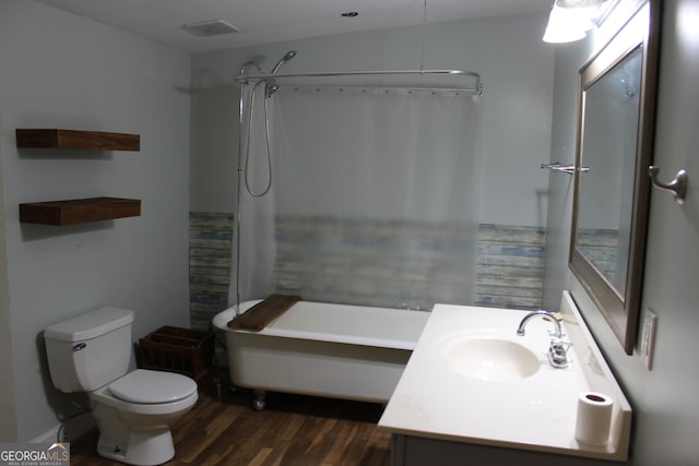 full bathroom featuring plus walk in shower, toilet, vanity, and hardwood / wood-style flooring