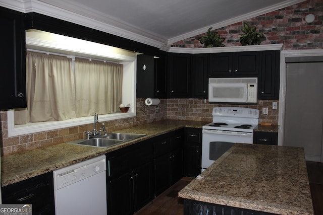 kitchen with brick wall, white appliances, crown molding, sink, and lofted ceiling