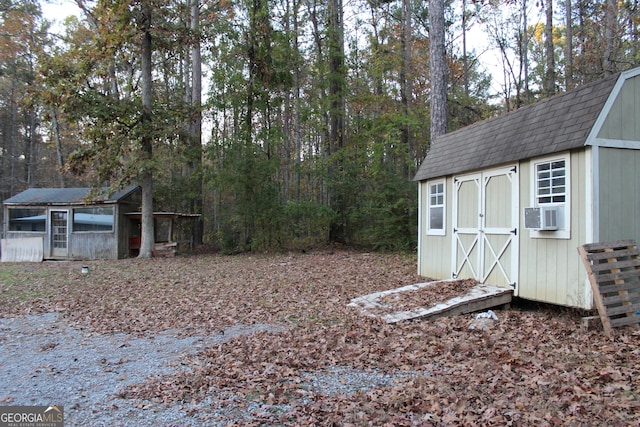 view of outbuilding featuring cooling unit