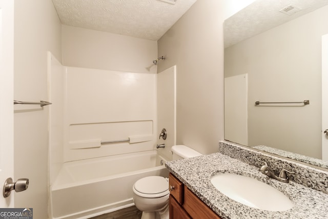 full bathroom with wood-type flooring, a textured ceiling, shower / bath combination, vanity, and toilet