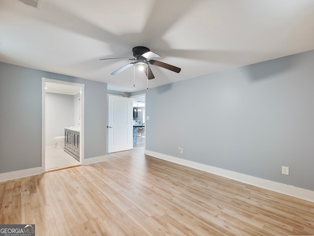 unfurnished room with ceiling fan and light hardwood / wood-style floors