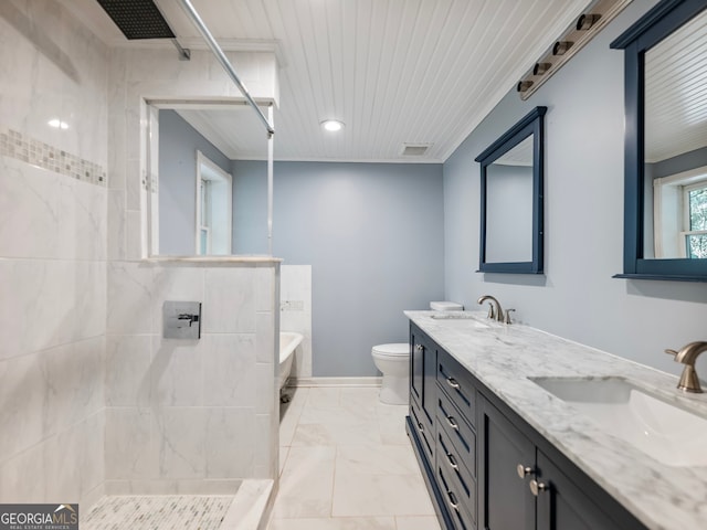 full bathroom with vanity, separate shower and tub, and toilet