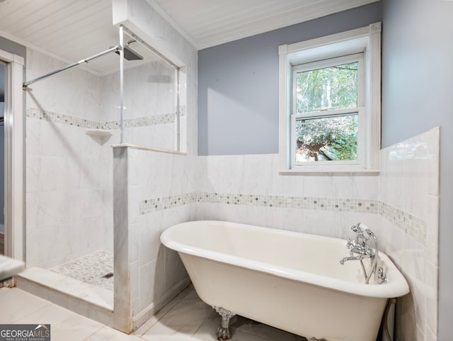 bathroom featuring tile walls and independent shower and bath