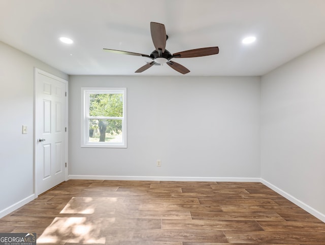 empty room featuring wood-type flooring and ceiling fan