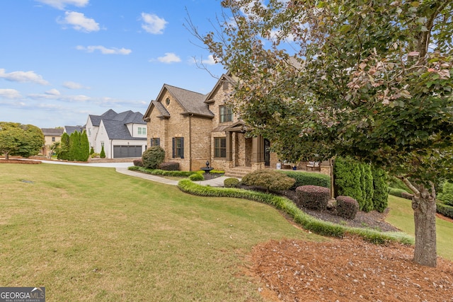 view of front facade featuring a garage and a front lawn