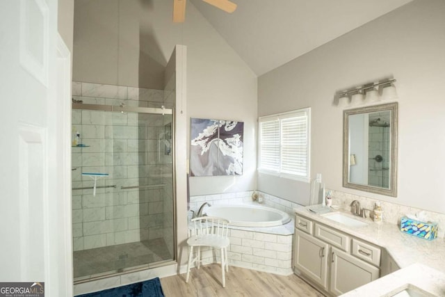 bathroom with hardwood / wood-style floors, vanity, lofted ceiling, plus walk in shower, and ceiling fan