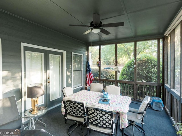 sunroom / solarium featuring ceiling fan