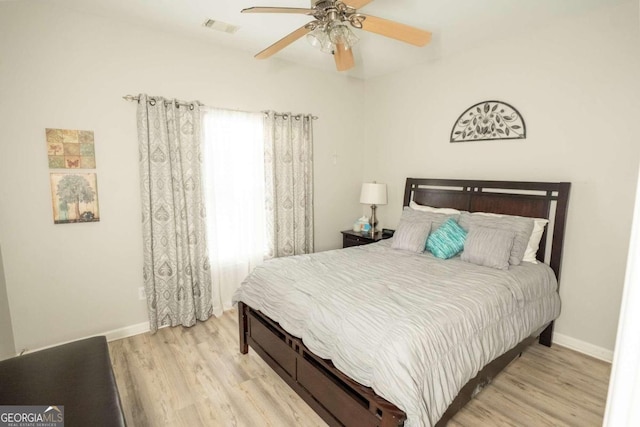 bedroom featuring light hardwood / wood-style flooring and ceiling fan