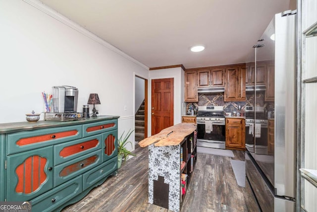 kitchen featuring crown molding, a center island, dark wood-type flooring, and stainless steel range with gas stovetop