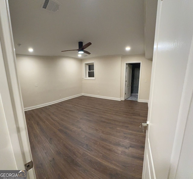 interior space featuring ceiling fan and dark hardwood / wood-style flooring