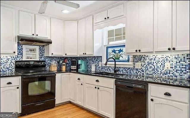 kitchen featuring white cabinets, light wood-type flooring, sink, and black appliances