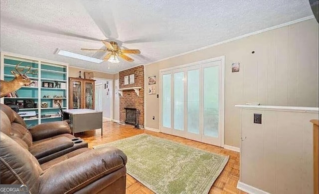 living room with a textured ceiling, light parquet flooring, and ceiling fan