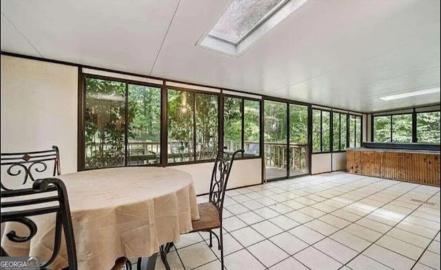 sunroom / solarium featuring a skylight