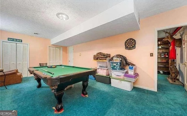 rec room with carpet floors, a textured ceiling, and pool table