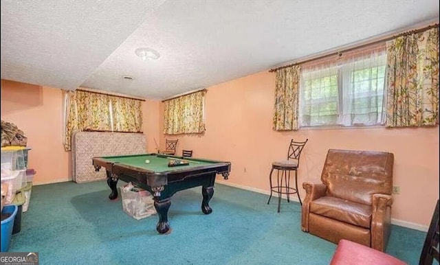 rec room with a textured ceiling, carpet, and billiards