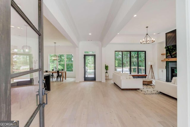 living room featuring light hardwood / wood-style flooring and a chandelier