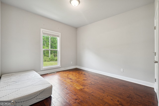 bedroom featuring hardwood / wood-style flooring