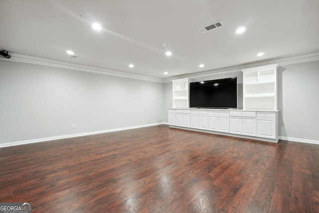 unfurnished living room featuring ornamental molding and dark hardwood / wood-style floors