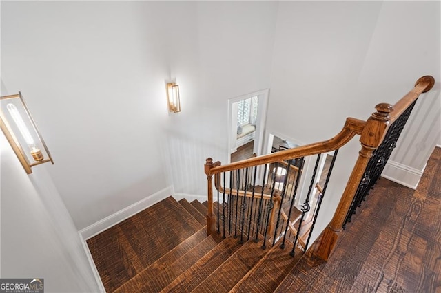 stairway featuring hardwood / wood-style floors