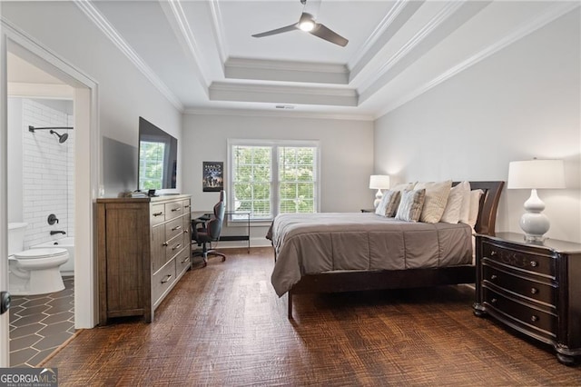 bedroom with crown molding, ensuite bathroom, dark wood-type flooring, and ceiling fan