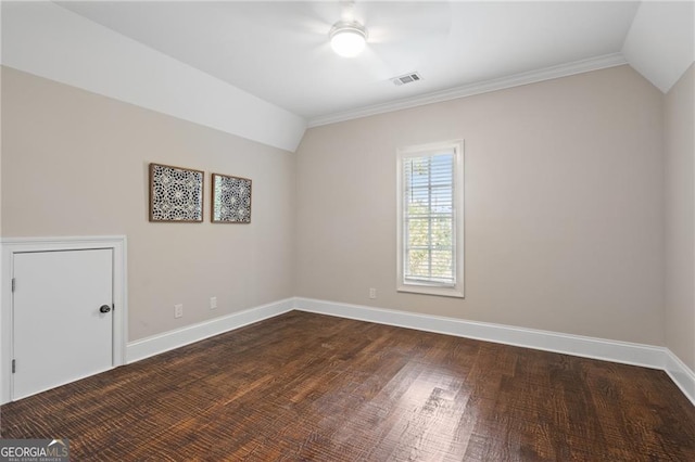 unfurnished room featuring ceiling fan, ornamental molding, lofted ceiling, and dark hardwood / wood-style floors