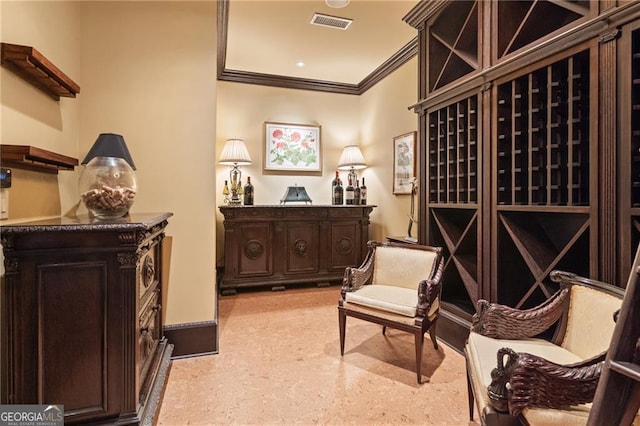 wine cellar featuring ornamental molding