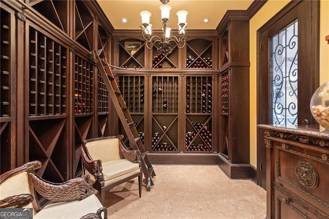 wine room with ornamental molding and an inviting chandelier