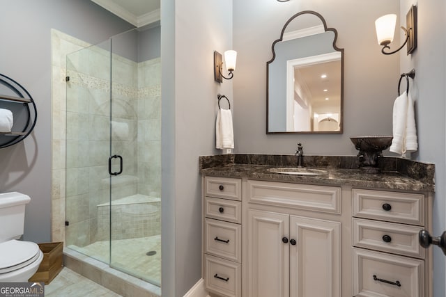 bathroom with vanity, a shower with shower door, ornamental molding, and toilet