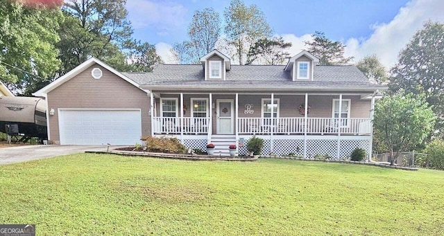 view of front of house featuring a porch, a garage, and a front yard