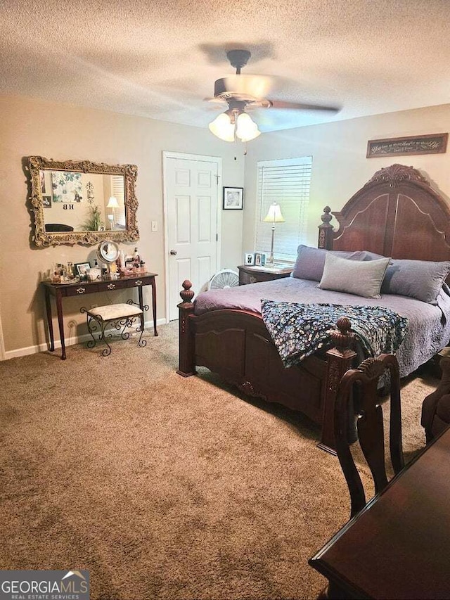 bedroom with carpet, a textured ceiling, and ceiling fan