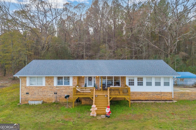 single story home with a porch and a front lawn