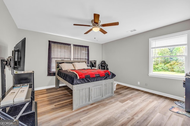 bedroom featuring ceiling fan and light hardwood / wood-style flooring