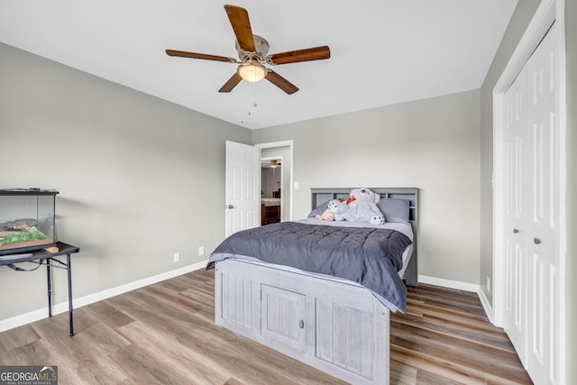 bedroom featuring a closet, ceiling fan, and hardwood / wood-style floors