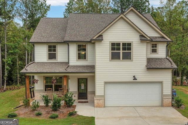 view of front of house featuring covered porch and a garage