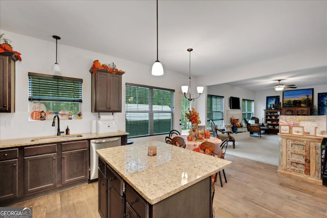 kitchen with dark brown cabinetry, dishwasher, sink, and a kitchen island