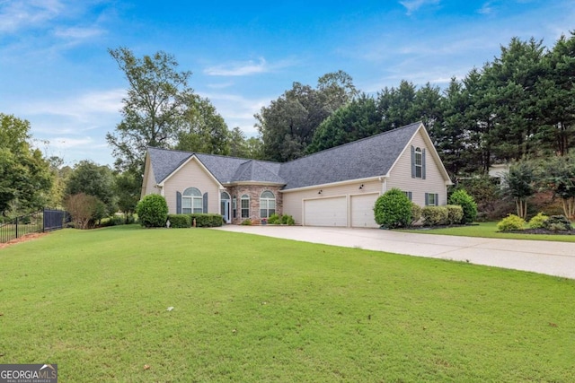 view of front of home with a front yard and a garage