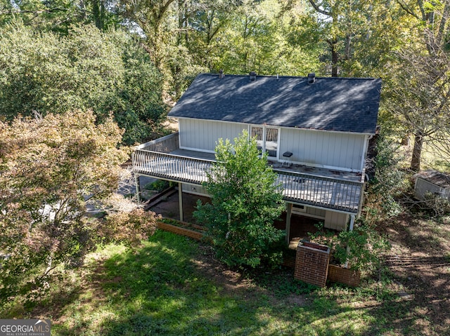 back of house featuring a wooden deck