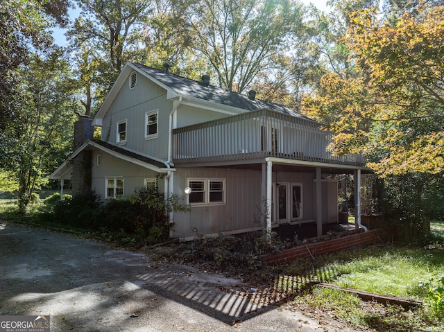 view of side of property featuring a porch