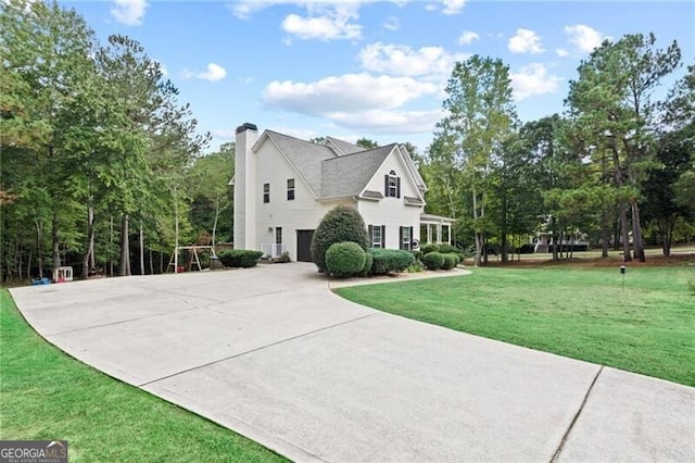 view of side of property with a yard