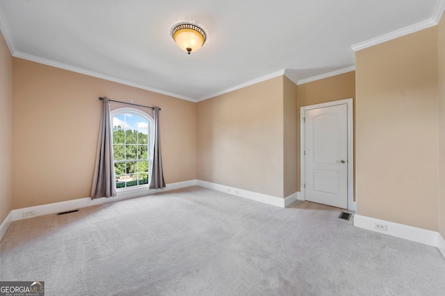 unfurnished room featuring crown molding and light colored carpet