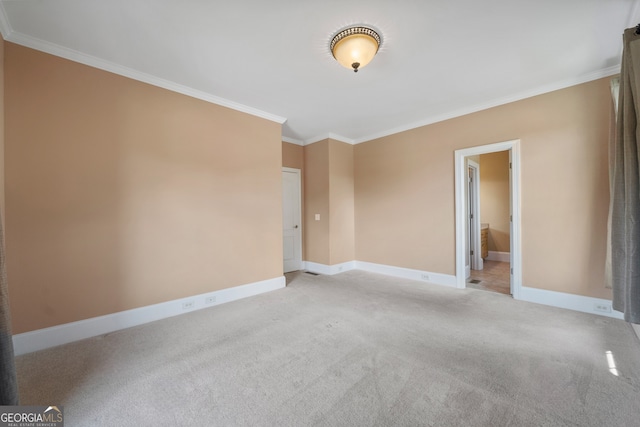 carpeted empty room with ornamental molding