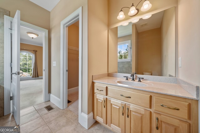 bathroom featuring tile patterned floors, vanity, and toilet