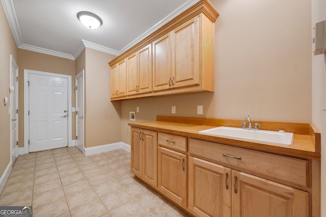 laundry room with washer hookup, light tile patterned floors, cabinets, ornamental molding, and sink