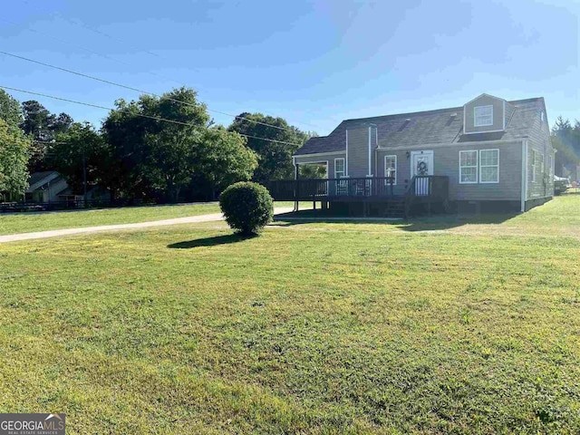 view of yard with a wooden deck