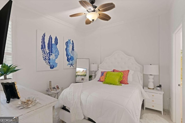 bedroom featuring ornamental molding and ceiling fan