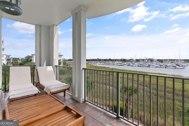 balcony featuring a water view