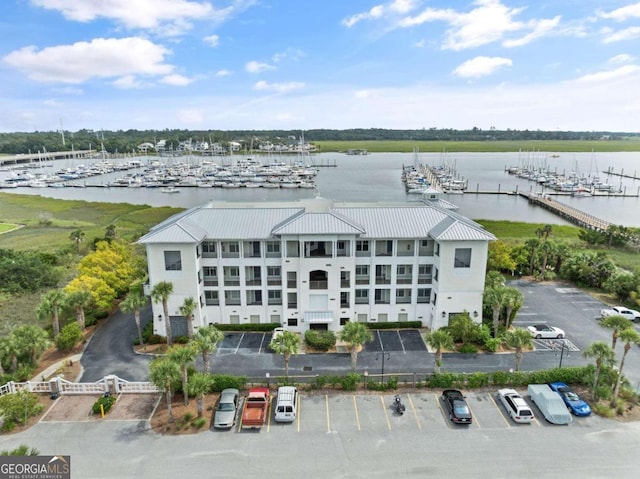 birds eye view of property with a water view