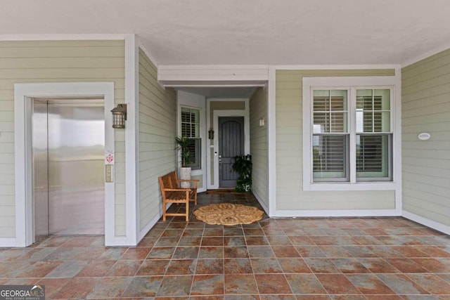 doorway to property featuring elevator