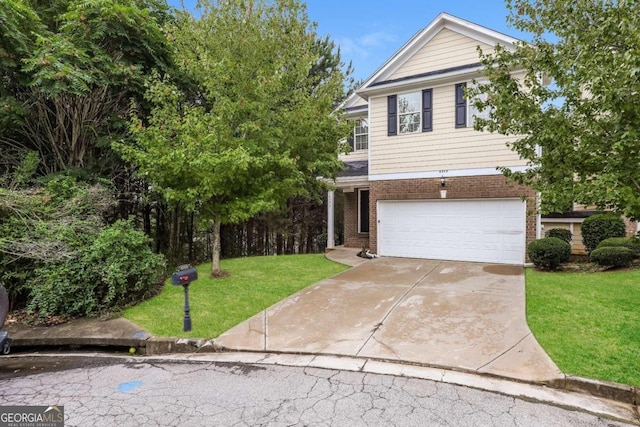 view of front of house featuring a front yard and a garage